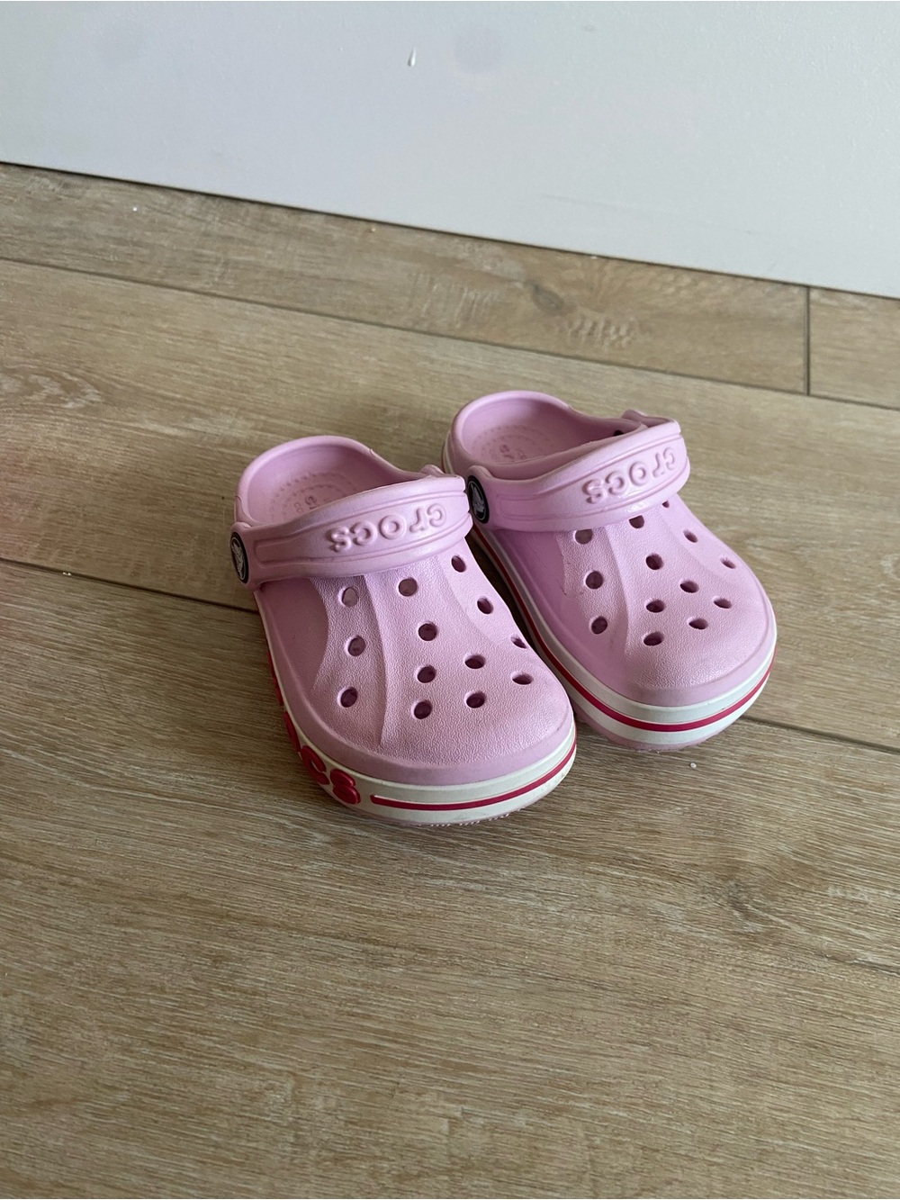 CROCS Kids' Classic Clog in Light Pink with White Stripe